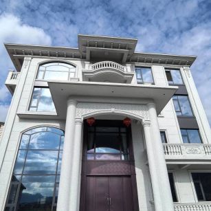 江西白麻别墅外墙干挂石材效果示例